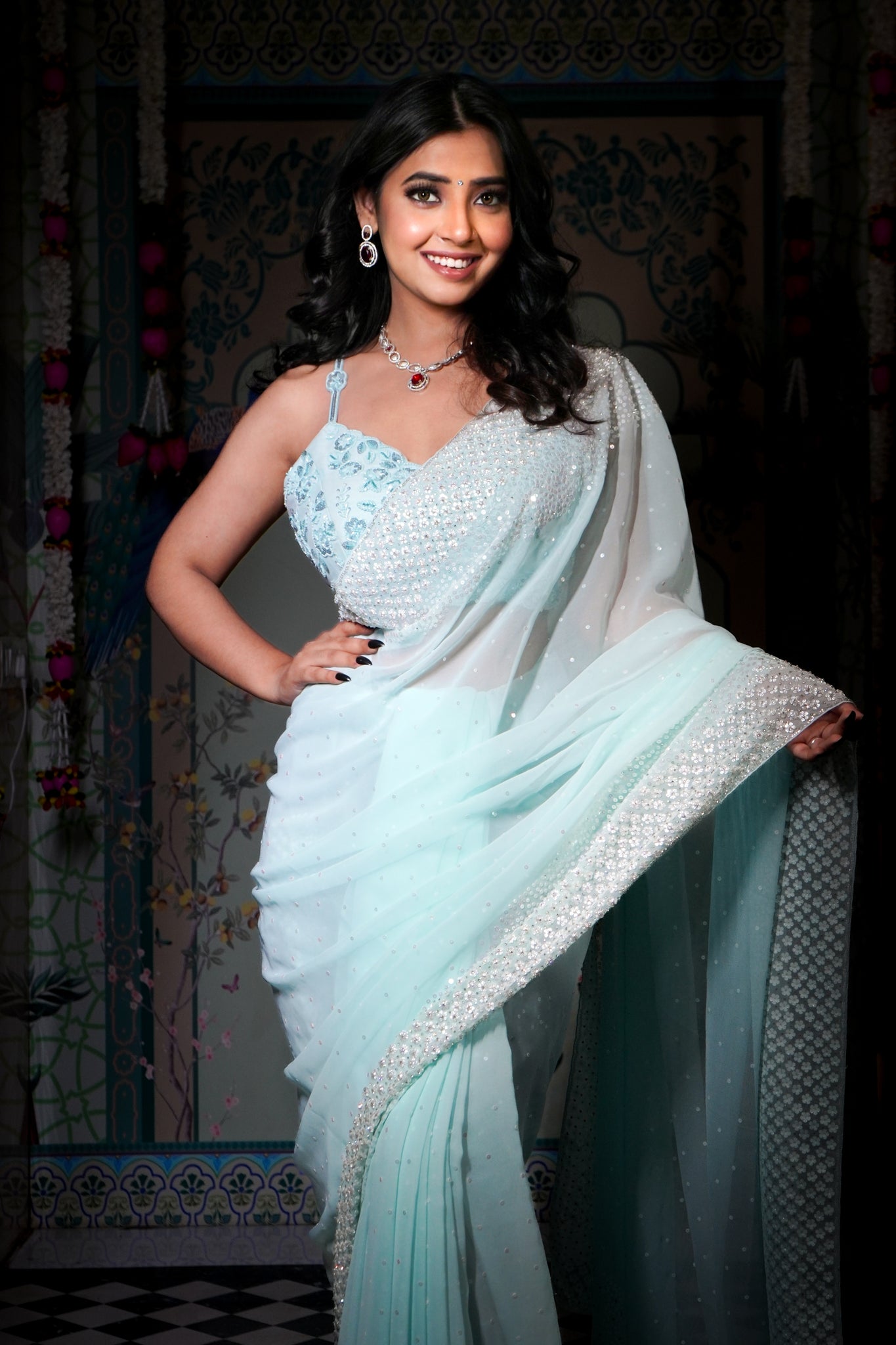 Aarzoo-Glam collection couture saree . Silver sequins and cutdana on a aqua blue georgette base, saree.