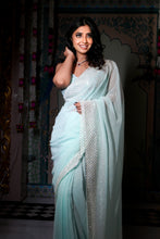 Aarzoo-Glam collection couture saree . Silver sequins and cutdana on a aqua blue georgette base, saree.