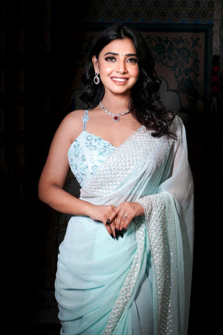 Aarzoo-Glam collection couture saree . Silver sequins and cutdana on a aqua blue georgette base, saree.