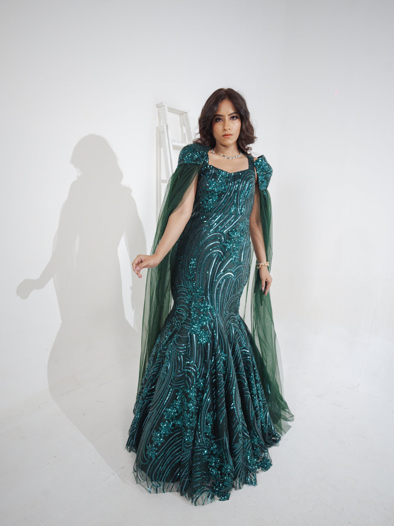 ELIZE- Emerald Green mermaid cut Embroidered Gown in net with sequins & cutdana work.