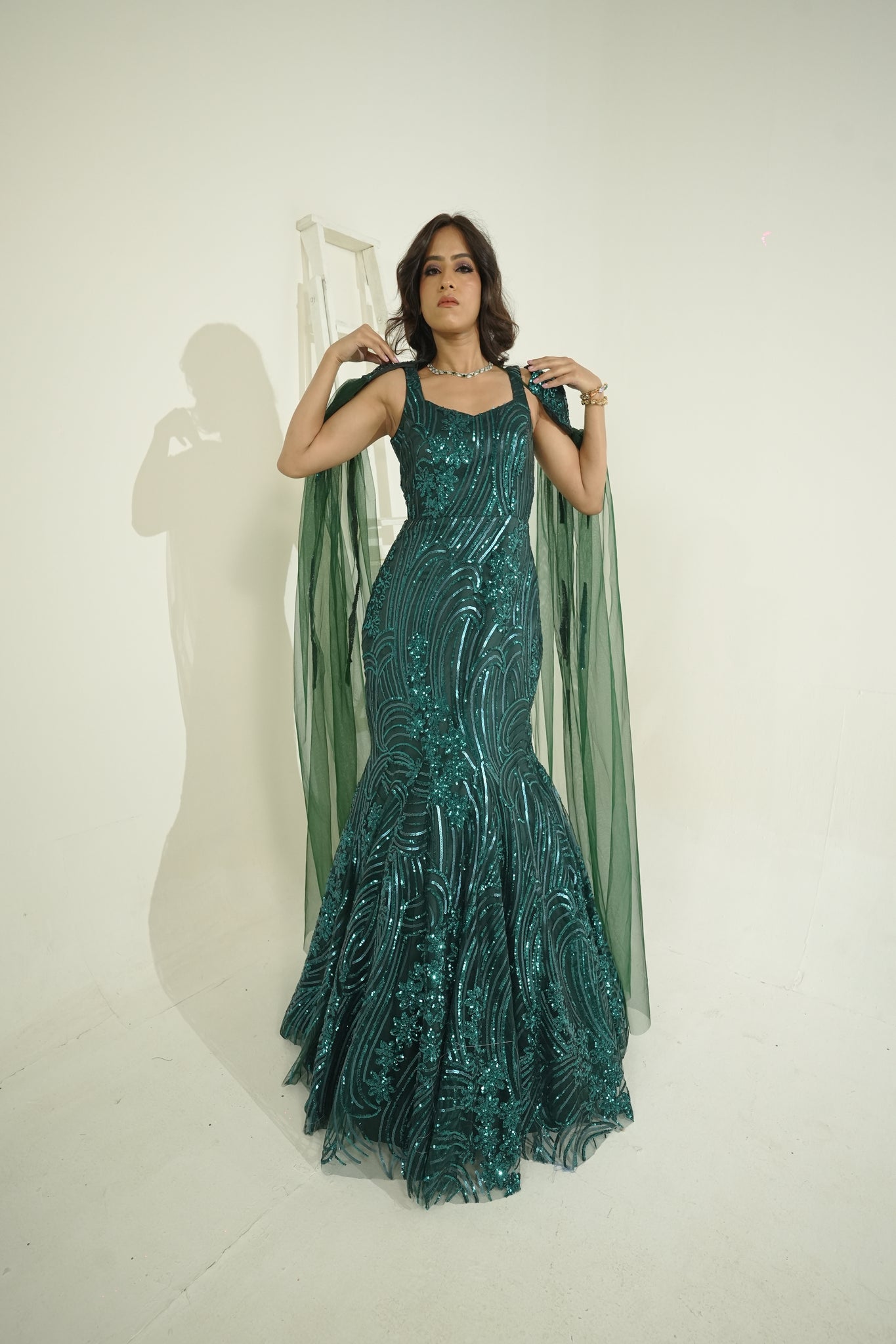 ELIZE- Emerald Green mermaid cut Embroidered Gown in net with sequins & cutdana work.