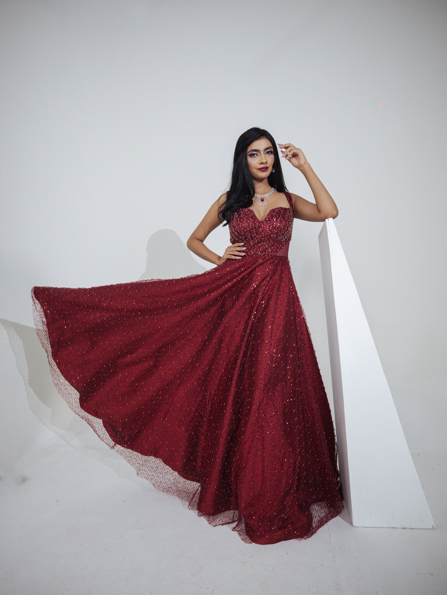 oliya - Embroidered red gown in net sequins & cutdana work.