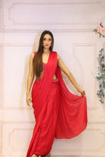 Description:-Red ready drape saree with Matching sequin blouse.