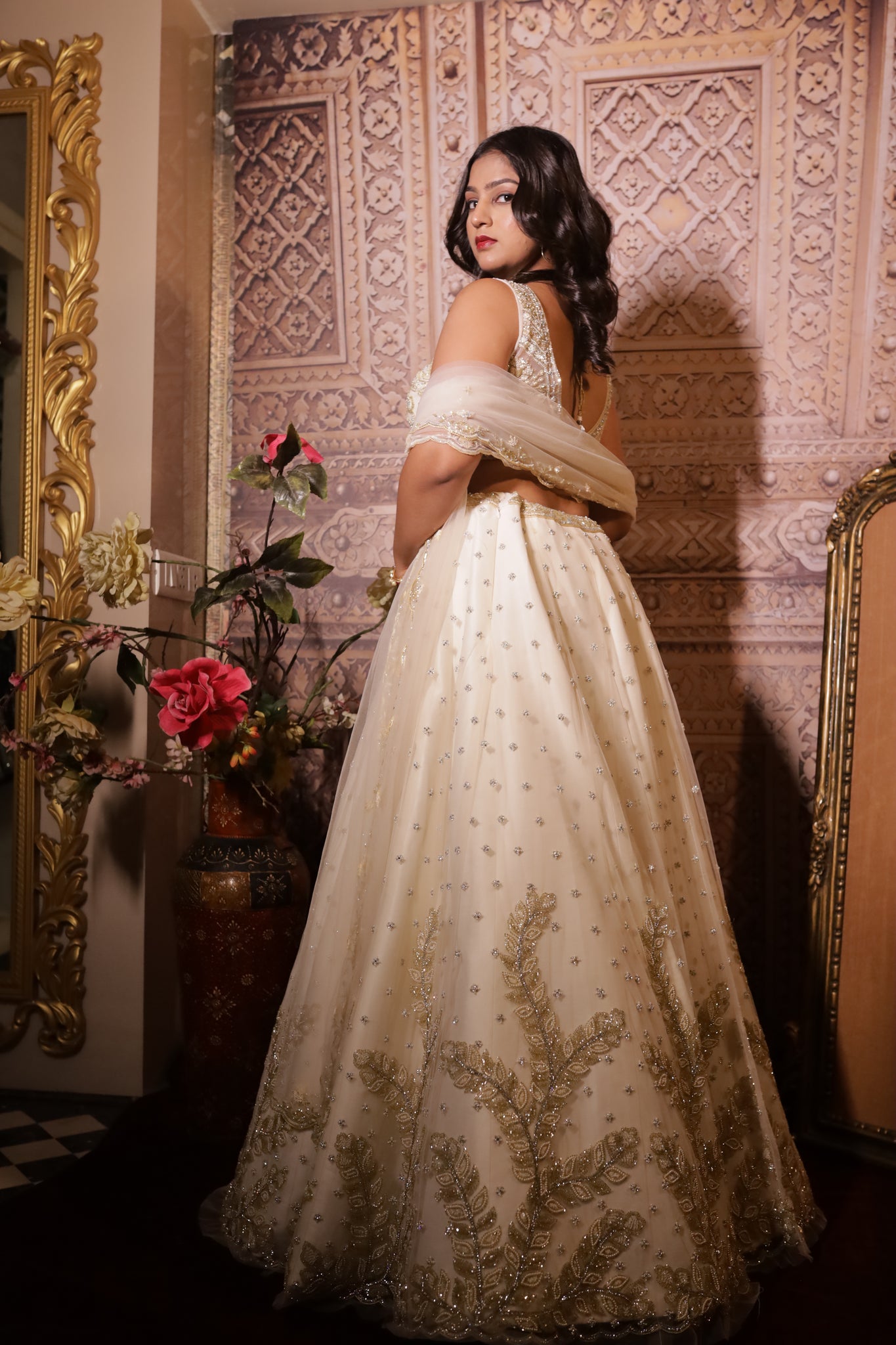 KRISHA - Ivory Net Embroidered  With Stone And Pearls Reception Lehenga.