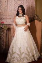 KRISHA - Ivory Net Embroidered  With Stone And Pearls Reception Lehenga.