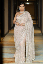 CLARA-Peach Net Hand Embroidered saree in stone work