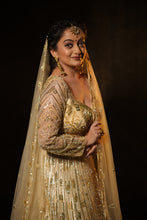 AISHA - GOLD Embroidered  Lehenga In Net With Sequins And Cutdana Work.