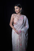 ANSHIKA-Powder White Saree In Organza With 3D Flower Embroidery Border And Buttis Featuring Multicolour Moti And Sequins