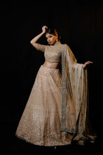 Golden net lehenga handcrafted in Sequin, pearl &amp; cutdana work with Matching blouse and Dupatta