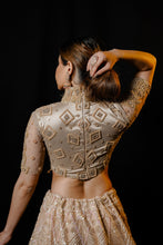 Golden net lehenga handcrafted in Sequin, pearl &amp; cutdana work with Matching blouse and Dupatta